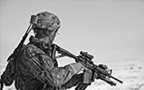 Soldier in desert in camouflage gear 