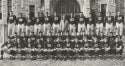 a black and white photograph of the 1938 Georgetown Football Team standing in front of White Gravenor Hall
