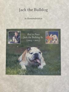 Front cover of memorial program for jack with a color photo of Jack running across grass