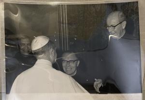 Pope greets a Jesuit priest