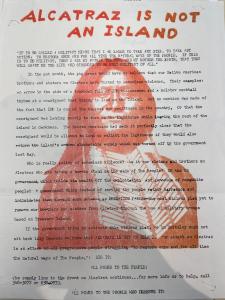 Alcatraz is not an island poem by Paul Muldoon. Text over an image of an American Indian