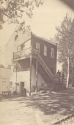 College bake house and store with Brother Gavan seated to the left, ca. 1889