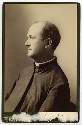 James Pye Neale, S.J. wearing his cossack in a side profile portrait, a torn label below the photograph