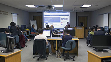 Students attend a library instruction session in the Dubin Classroom