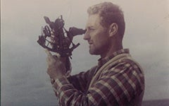 Michael Richey taking a sextant reading on an ocean-racing voyage