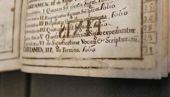 book page with handwritten Latin text after conservation treatment