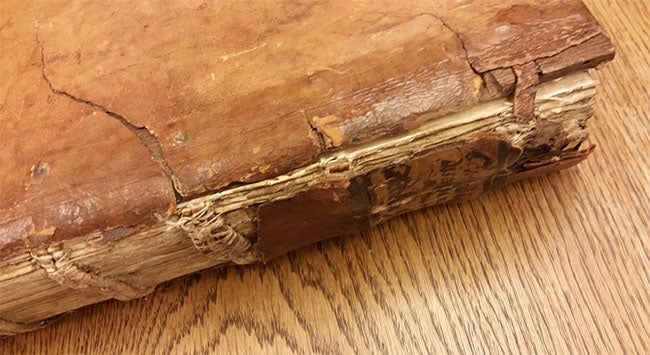 bookbinding with brown calf leather before conservation treatment