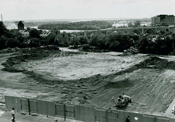 Bulldozers begin to clear the site for Lauinger Library