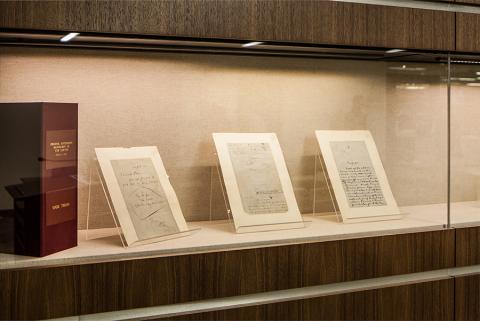 Pages from the handwritten manuscript of 'Tom Sawyer' on display in the Barbara Ellis Jones (C'1974) Inquiry Classroom.