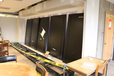 Installation of new exhibition cases in the Fairchild Gallery on December 9, 2014.