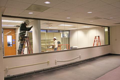 Workers preparing the temporary BFCSC home on the first floor of Lauinger Library.