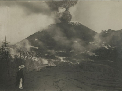 Person in front of a volcano