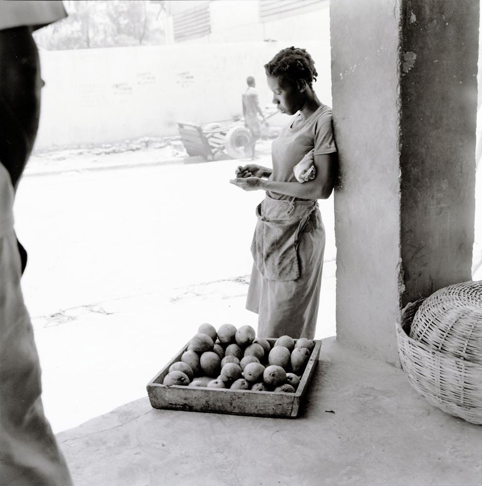 Girl leaning by the column