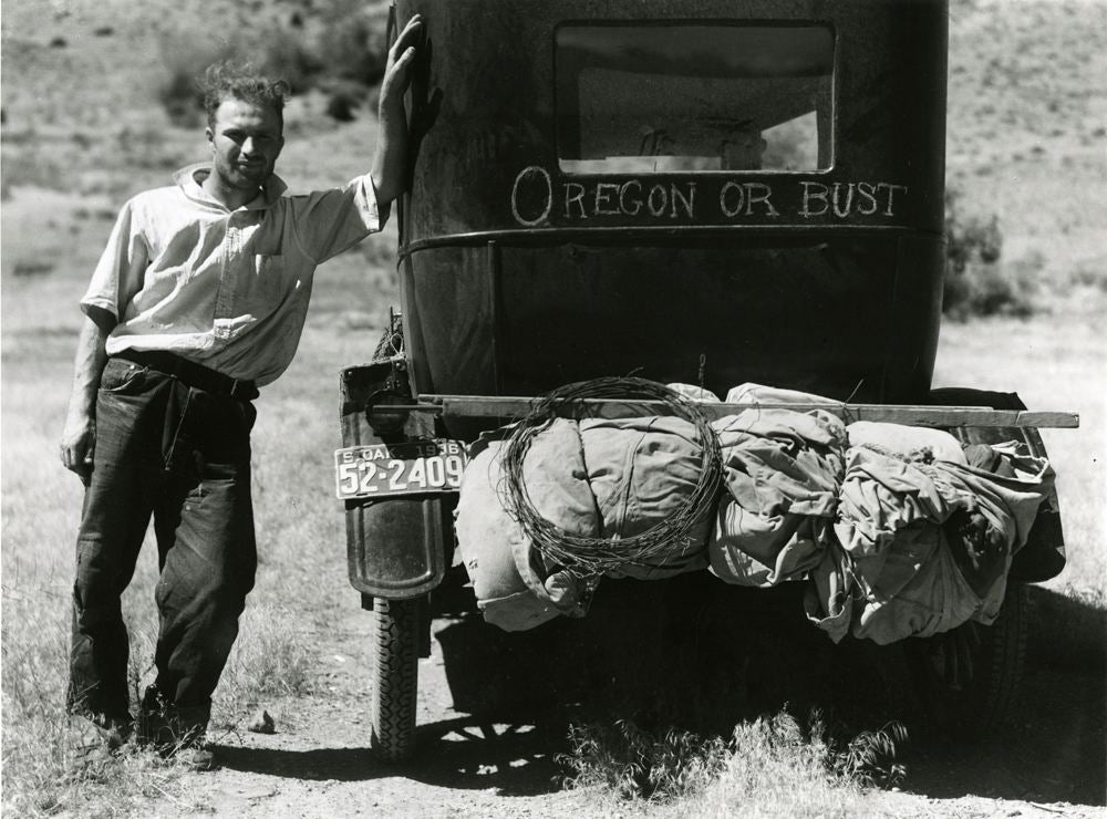 Migrant on the way to Oregon from South Dakota with packed car