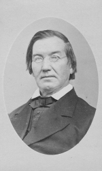 Black and white portrait photograph of John Early