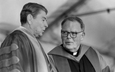 In 1988, President Ronald Reagan posed with Georgetown University President Timothy S. Healy, S.J., at the Inaugural Convocation for the Georgetown University Bicentennial celebrations.